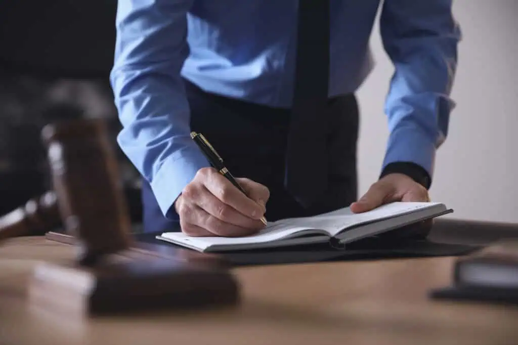 HOA board reviewing a budget shortfall caused by unexpected HOA attorney fees